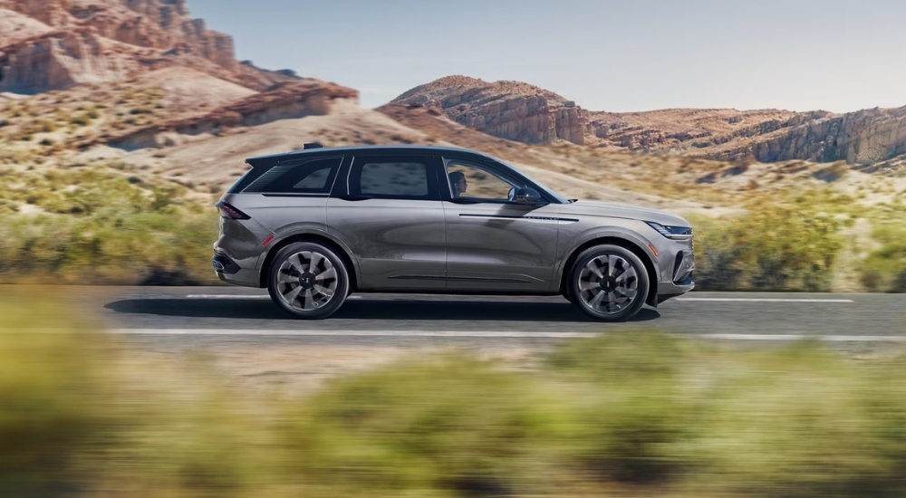 A grey 2025 Lincoln Nautilus from the side after leaving a Lincoln dealer.