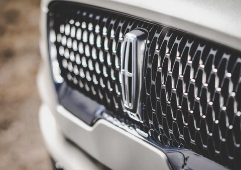 The grille of the 2024 Lincoln Aviator® Reserve model with an eye-catching repeated field of Lincoln Star logo shapes | LaFontaine Lincoln Flushing in Flushing MI