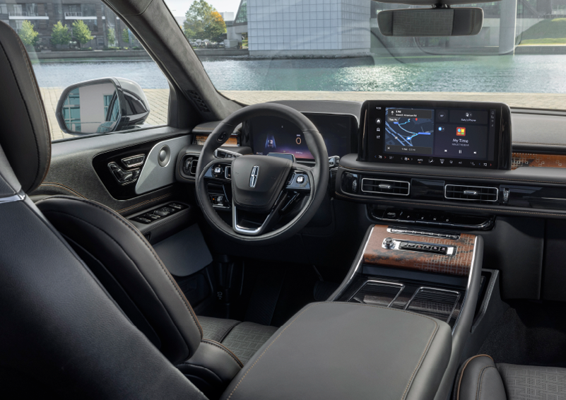 The interior of the 2025 Lincoln Aviator® SUV is shown parked with a view of a harbor through the windshield. | LaFontaine Lincoln Grand Blanc in Flint MI