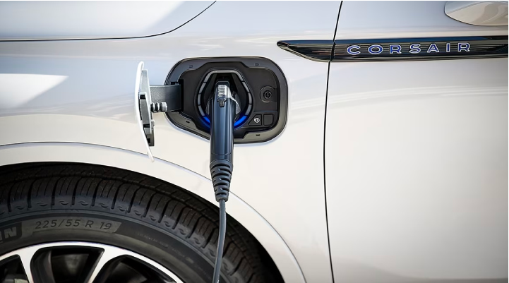 An electric charger is shown plugged into the charging port of a Lincoln Corsair® Grand Touring
model. | LaFontaine Lincoln Grand Blanc in Flint MI