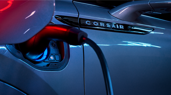 A charger plugged into the charging port of a 2025 Lincoln Corsair® Plug-in Hybrid model. | LaFontaine Lincoln Grand Blanc in Flint MI