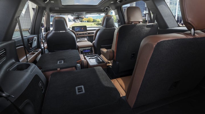 One side of the PowerFold® third-row seat and a second-row seat are folded forward in the 2026 Lincoln Aviator® SUV. | LaFontaine Lincoln Grand Blanc in Flint MI