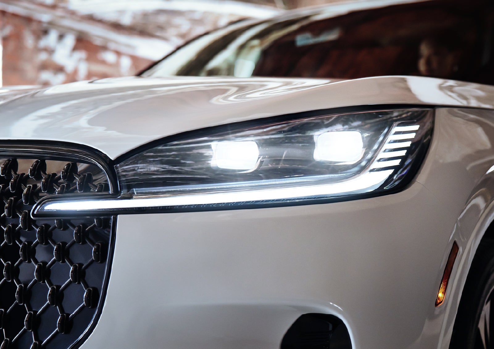 A close-up of a headlamp on the 2027 Lincoln Aviator® SUV is shown. | LaFontaine Lincoln Grand Blanc in Flint MI