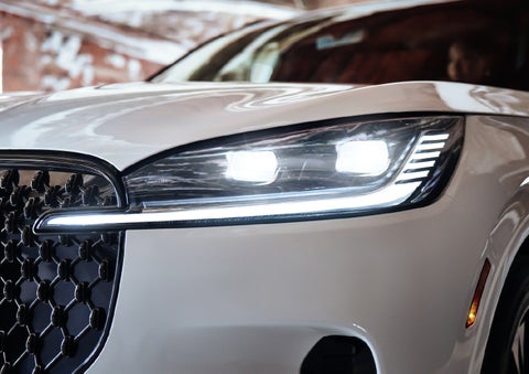 A close-up of a headlamp on the 2027 Lincoln Aviator® SUV is shown. | LaFontaine Lincoln Grand Blanc in Flint MI