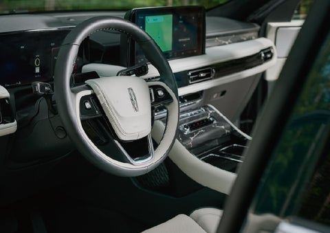 The leather-trimmed steering wheel of a 2027 Lincoln Aviator® Black Label™ SUV. | LaFontaine Lincoln Grand Blanc in Flint MI