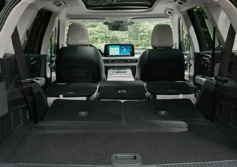 A rear to front view of the interior of a 2027 Lincoln Aviator® Black Label™ SUV shows the third and second rows folded flat | LaFontaine Lincoln Grand Blanc in Flint MI