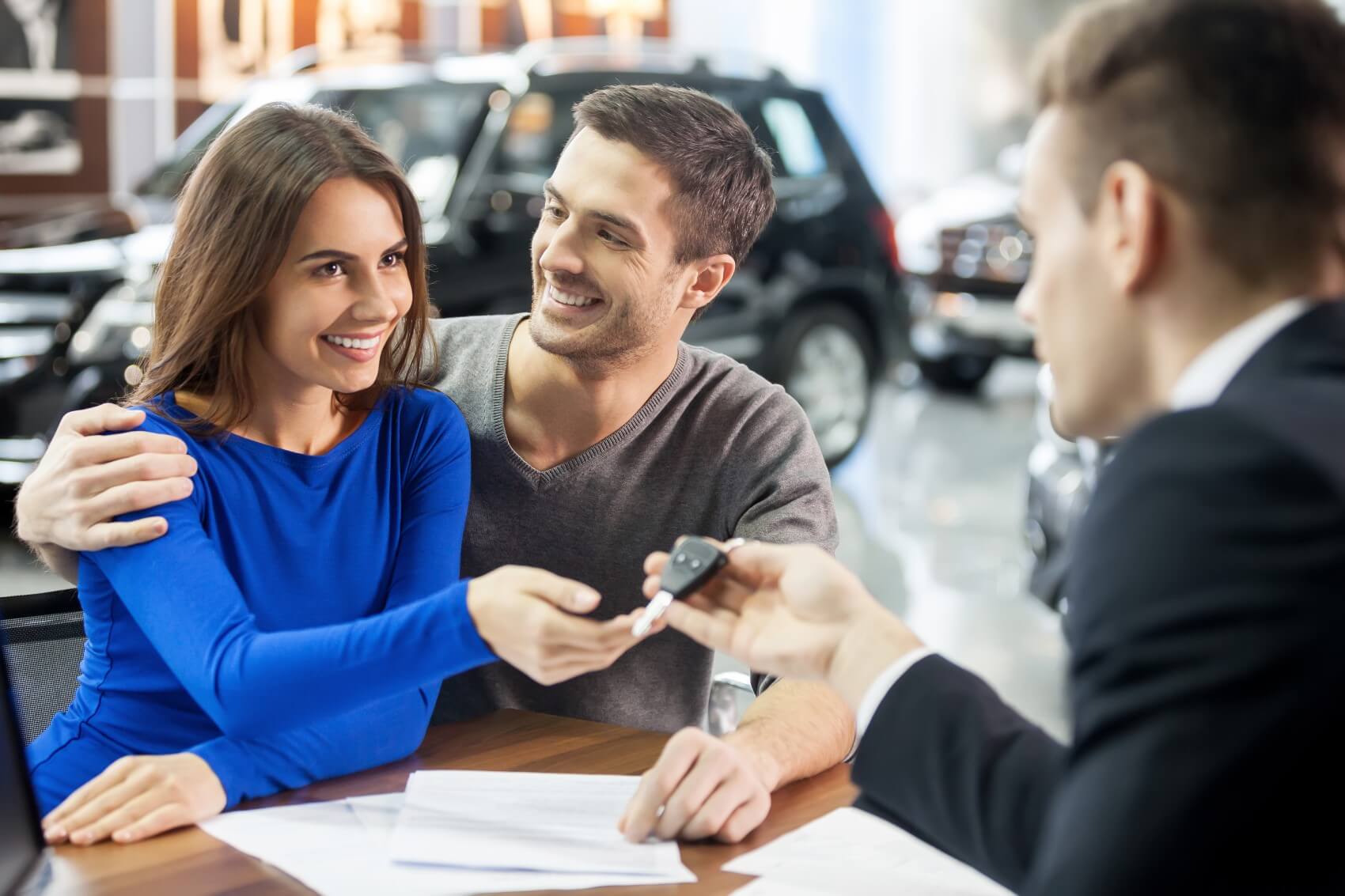Couple Receiving the Keys to a New Lincoln