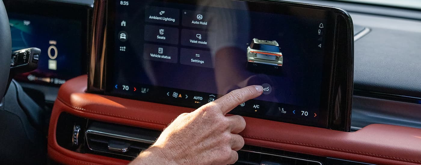 Man using infotainment screen in a 2025 Lincoln Aviator