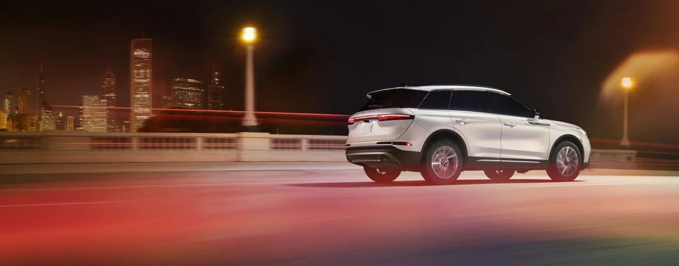 A white 2025 Lincoln Corsair from the side.