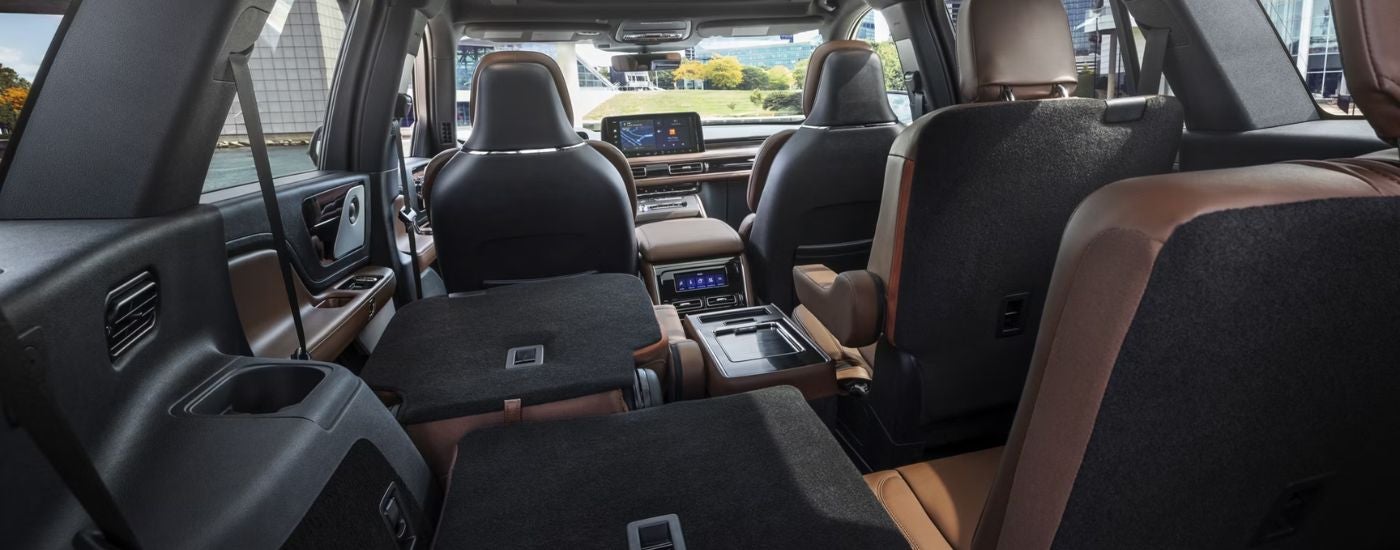 Brown and black leather interior of a 2026 Lincoln Aviator from the cargo area.