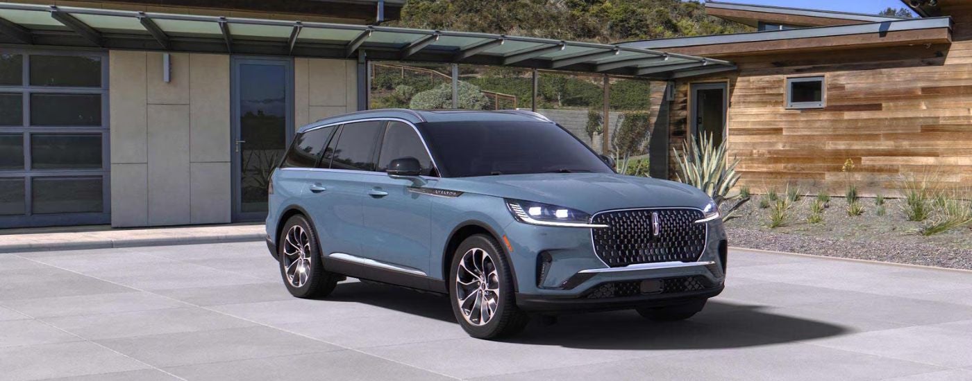 Blue 2026 Lincoln Aviator Reserve parked in a driveway.