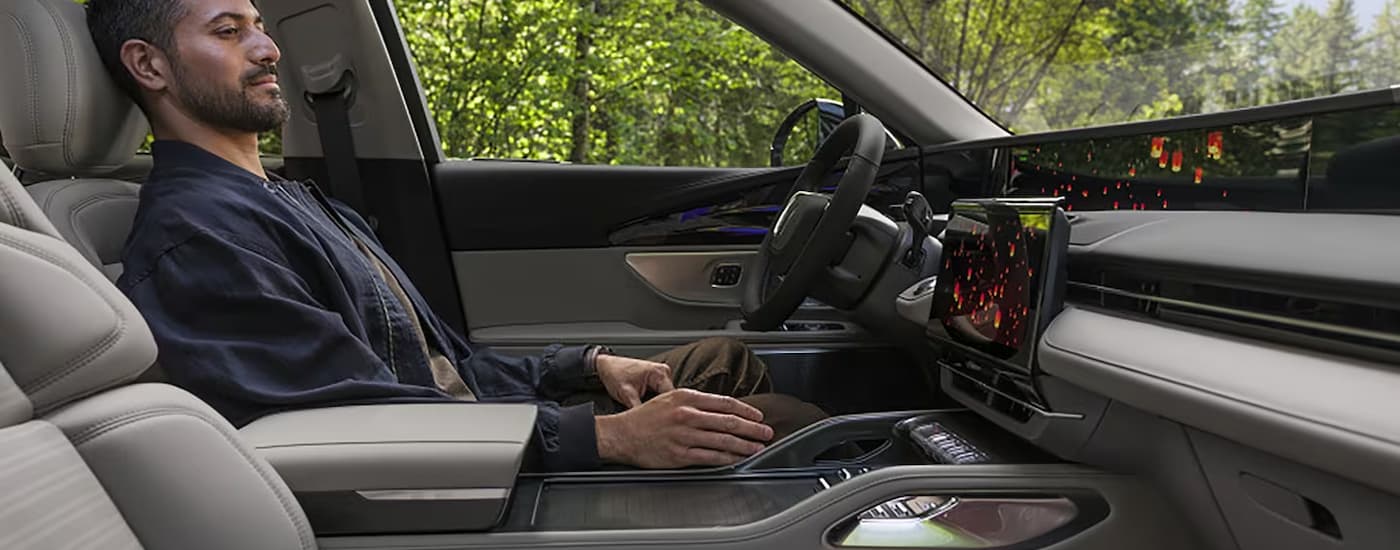 Man sitting in the driver's seat of a 2025 Lincoln Nautilus