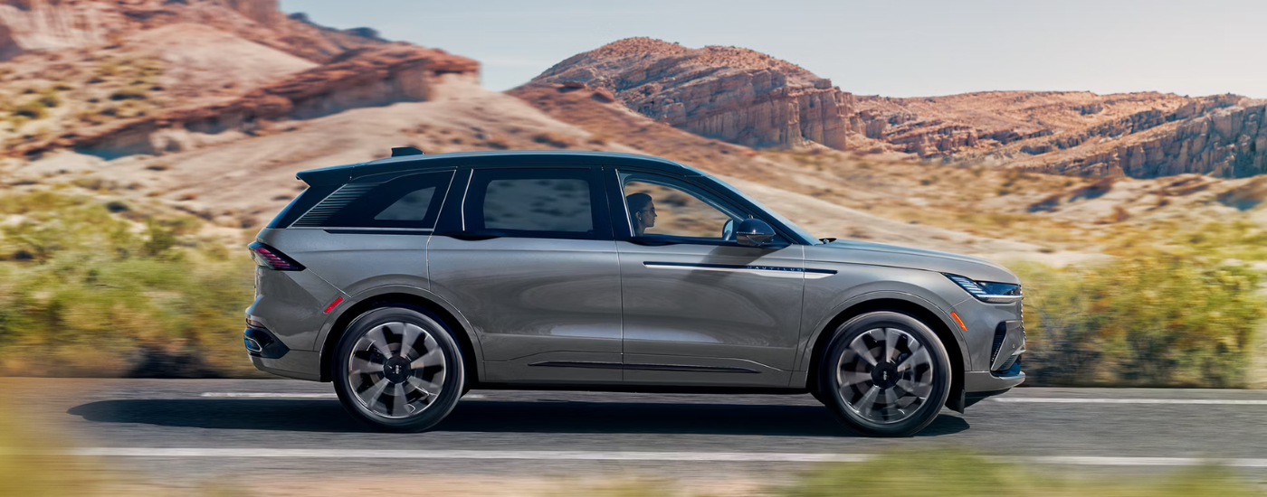 Side profile of a grey 2026 Lincoln Nautilus for sale near Grand Blanc on a test drive