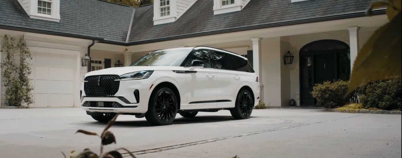 White 2026 Lincoln Aviator parked in a driveway.