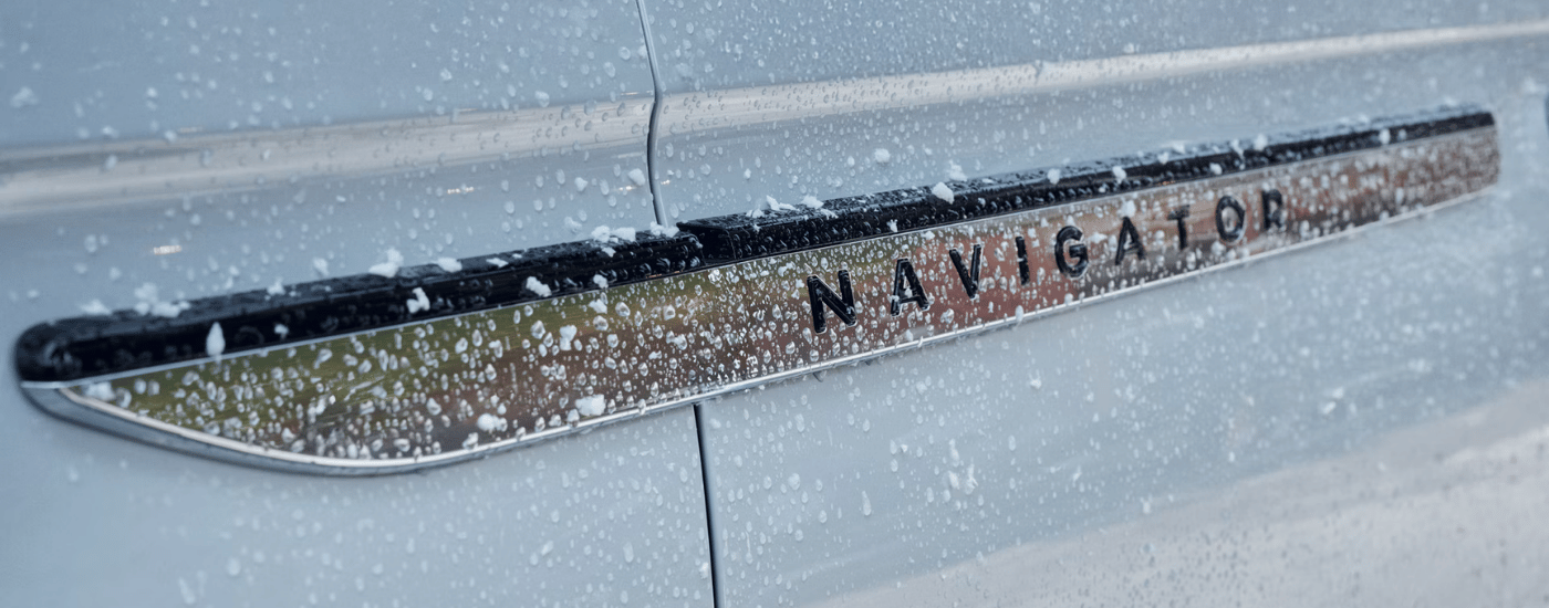 Chrome badging on a blue 2027 Lincoln Navigator