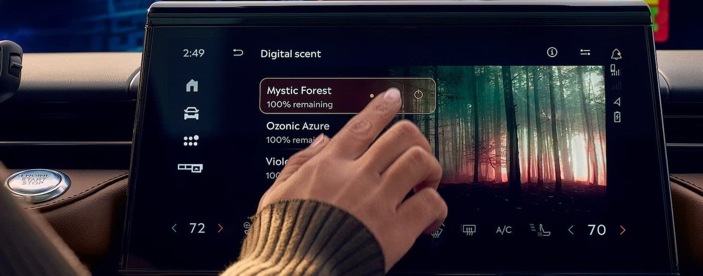 A person using the infotainment screen in a 2026 Lincoln Nautilus.