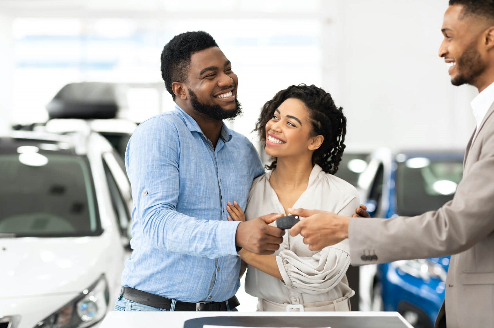Couple receiving car keys